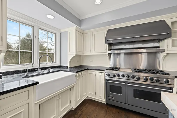 a kitchen with a stove and a sink