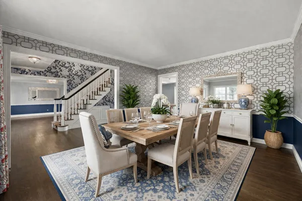 a view of a dining room with furniture and wooden floor