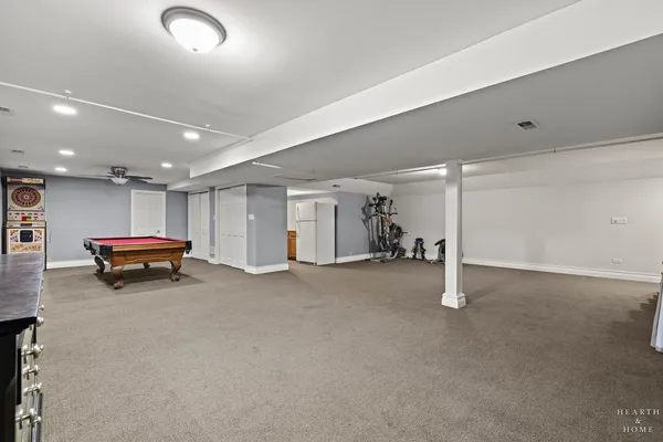 a view of empty room with wooden cabinets