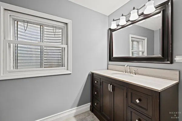 a bathroom with a sink and a mirror