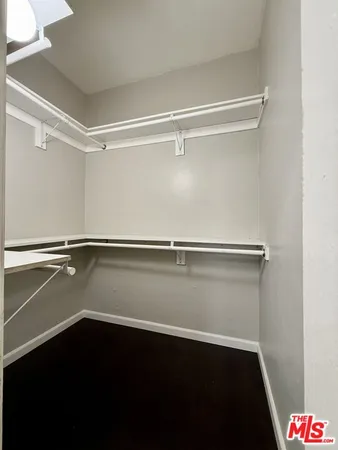 a view of an empty walk in closet