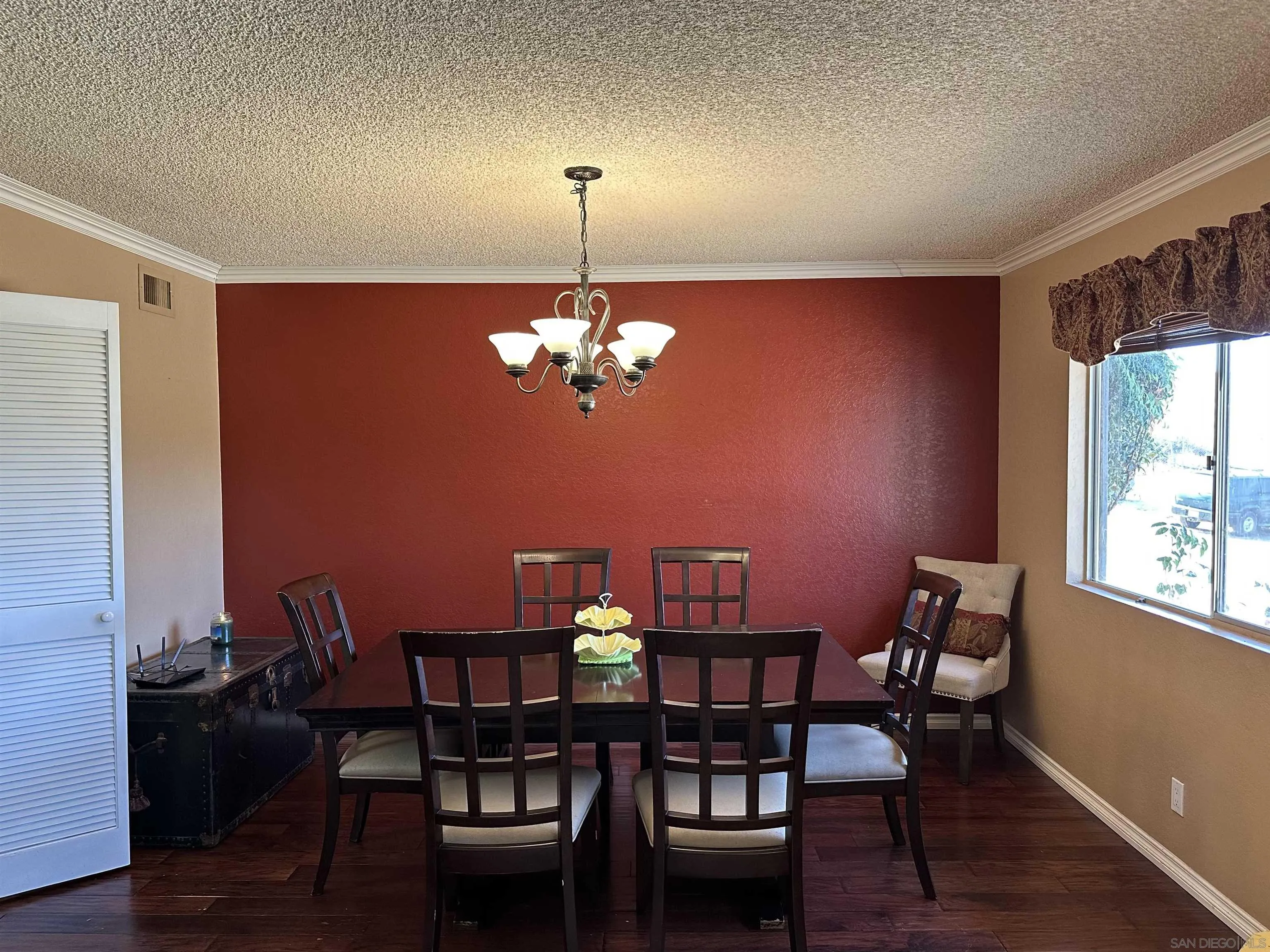 31440 Valley Center Road Valley Center, CA 92082 - Photo 8 of 28 a view of a dining room with furniture a chandelier and wooden floor