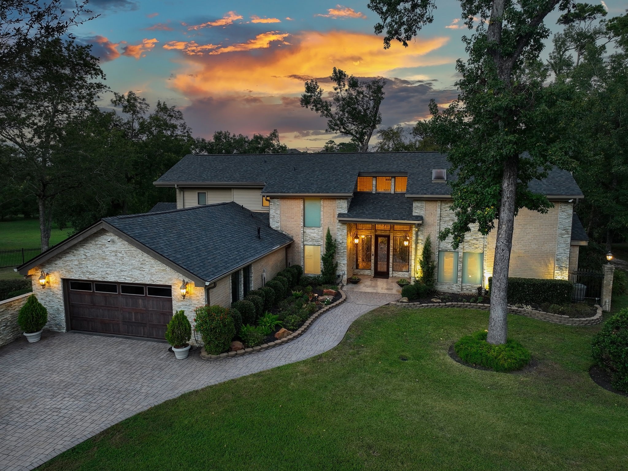 15628 Latson Street Houston, TX 77069 - Photo 3 of 50 a front view of a house with garden