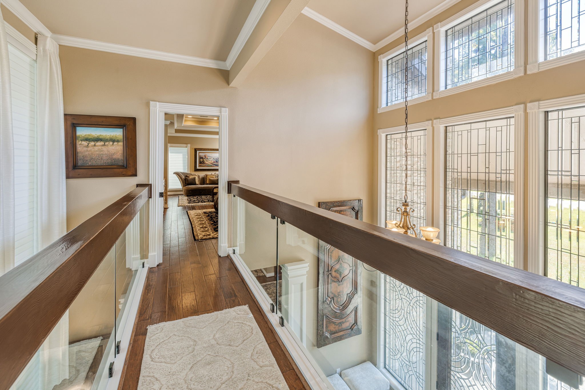 15628 Latson Street Houston, TX 77069 - Photo 35 of 50 a view of a hallway with wooden floor and staircase