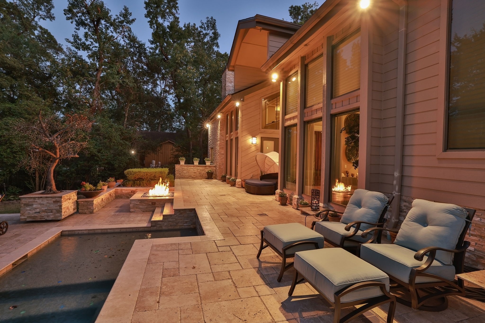 15628 Latson Street Houston, TX 77069 - Photo 40 of 50 a view of a patio with couches and chairs under an umbrella with large tree