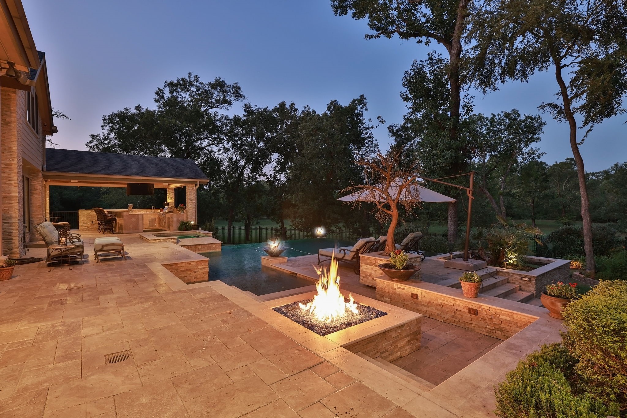 15628 Latson Street Houston, TX 77069 - Photo 41 of 50 a view of a patio with table and chairs and a fire pit