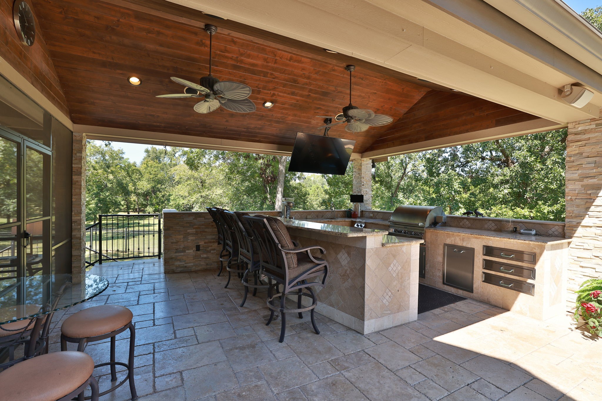 15628 Latson Street Houston, TX 77069 - Photo 43 of 50 a view of a patio with a dining table and chairs