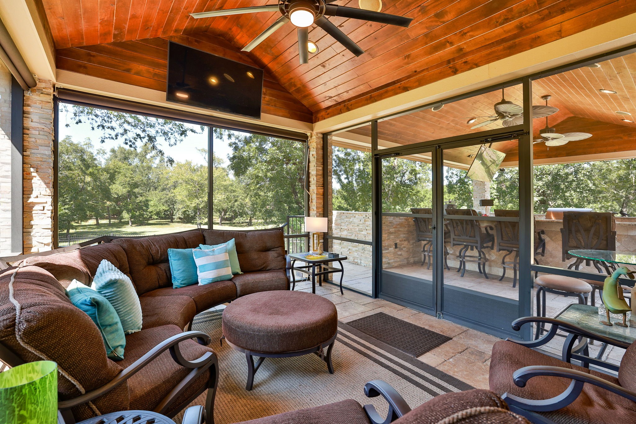 15628 Latson Street Houston, TX 77069 - Photo 45 of 50 a living room with furniture a flat screen tv and a floor to ceiling window