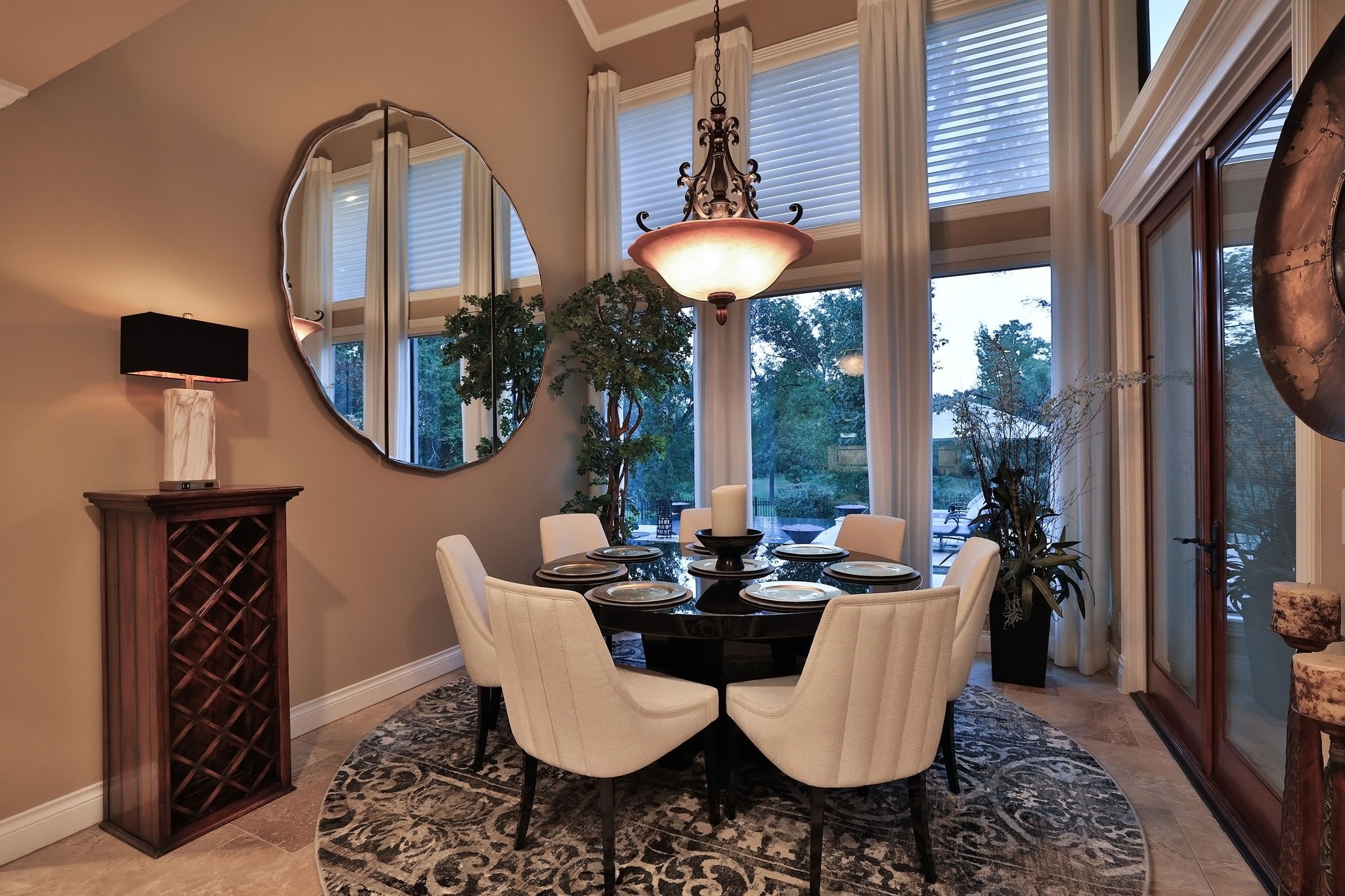 15628 Latson Street Houston, TX 77069 - Photo 9 of 50 a dining room with furniture a mirror and a large window