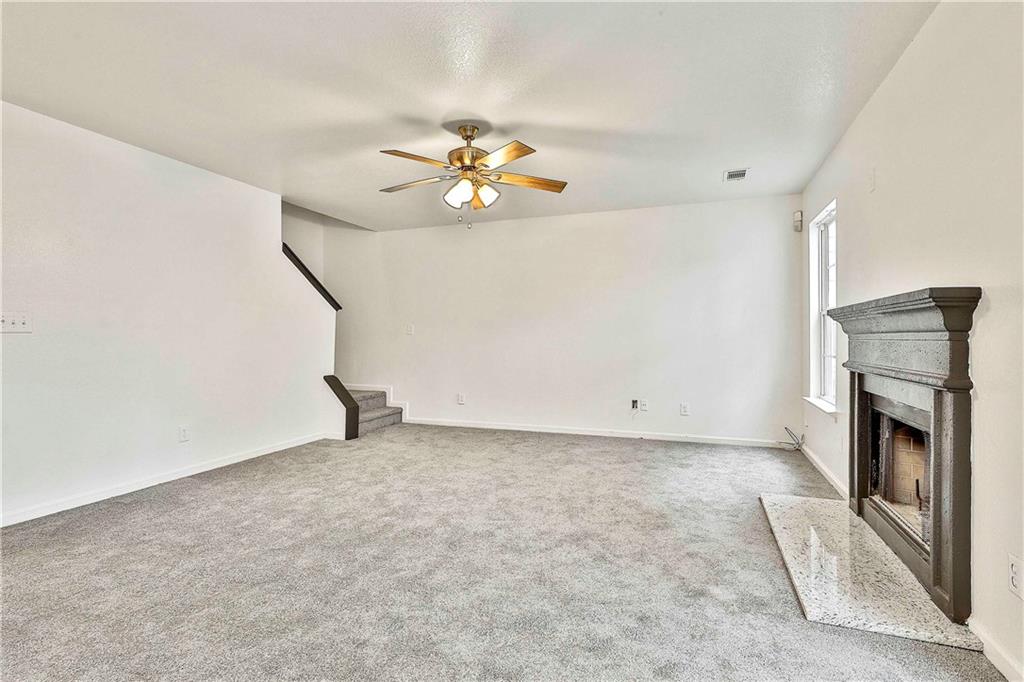 4605 Raven Wood Loop Union City, GA 30291 - Photo 12 of 24 a view of an empty room with a fireplace
