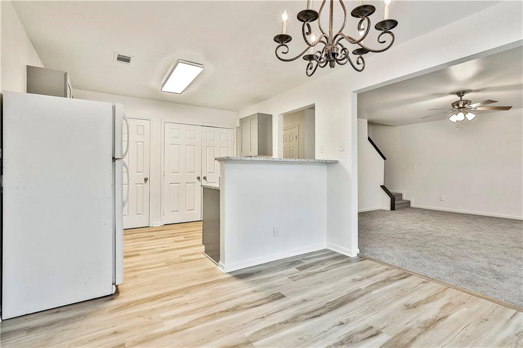 4605 Raven Wood Loop Union City, GA 30291 - Photo 9 of 24 a view of a hallway with wooden floor