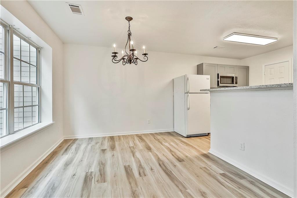 4605 Raven Wood Loop Union City, GA 30291 - Photo 10 of 24 a view of empty room with wooden floor and fan