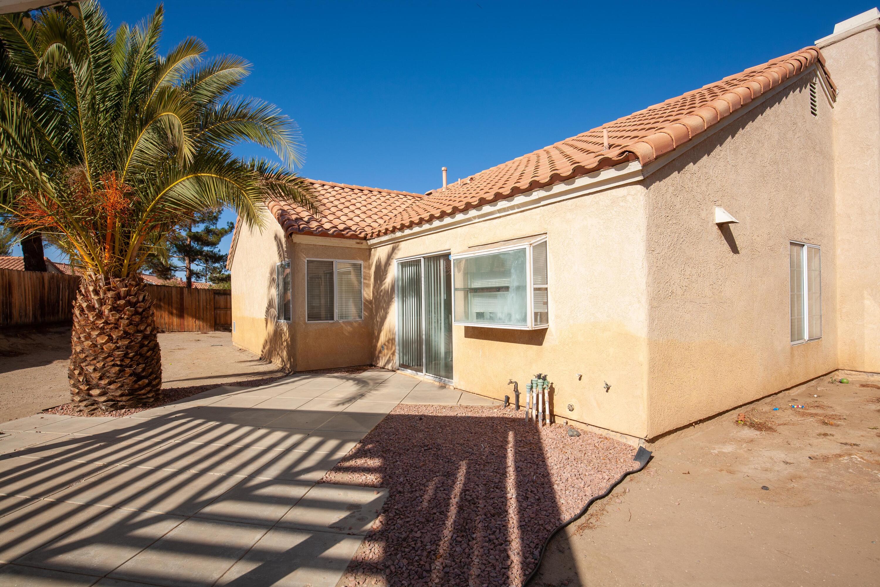 1628 Kings Road Palmdale, CA 93551 - Photo 22 of 22 a view of a house with a patio