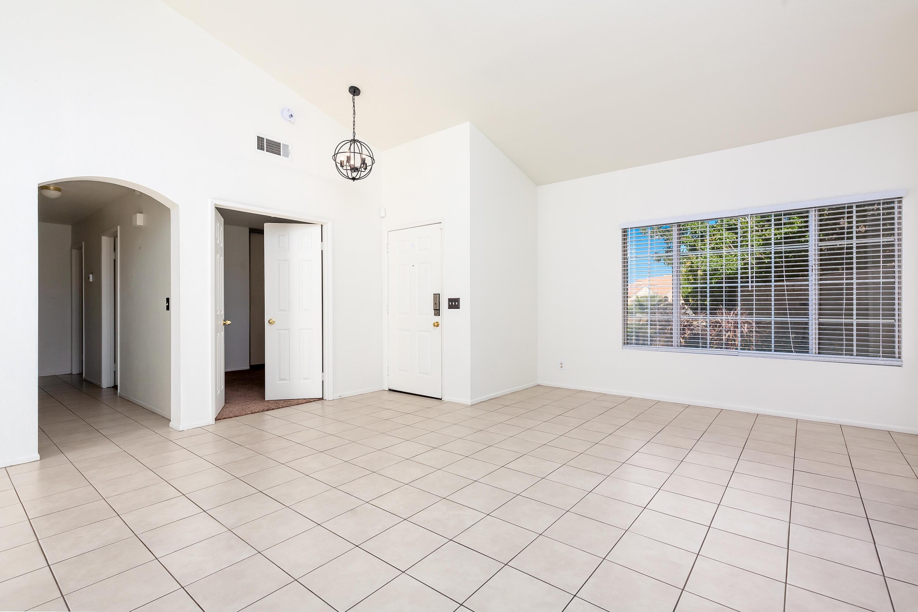 1628 Kings Road Palmdale, CA 93551 - Photo 5 of 22 an empty room with windows