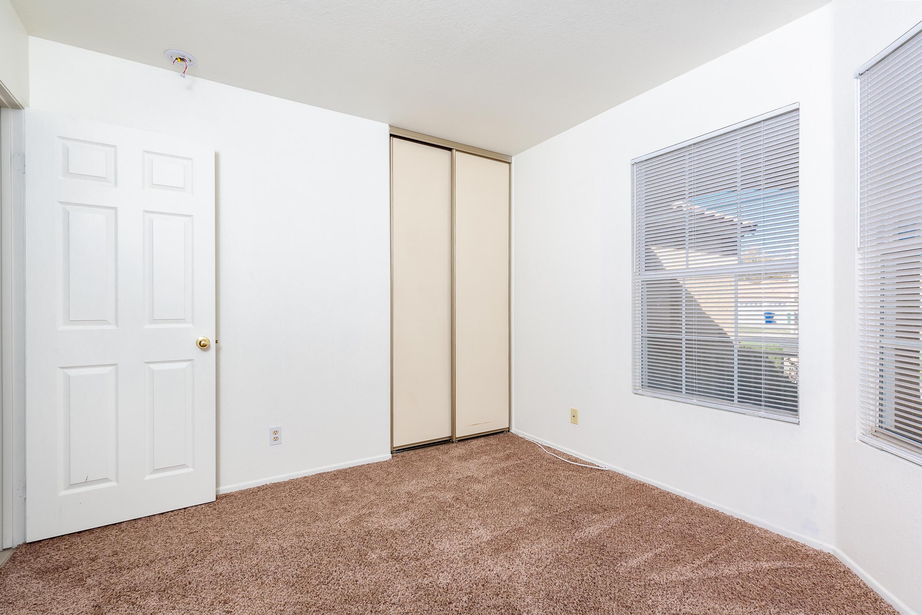 1628 Kings Road Palmdale, CA 93551 - Photo 10 of 22 a view of an empty room with a window