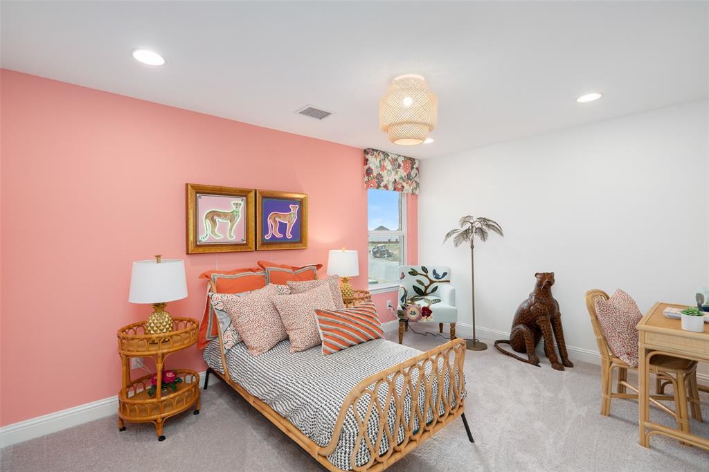 117 Pintail Lane Rhome, TX 76078 - Photo 21 of 29 a bedroom with furniture and a chandelier
