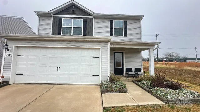 front view of a house with a yard