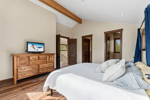 a bedroom with a bed and a dresser