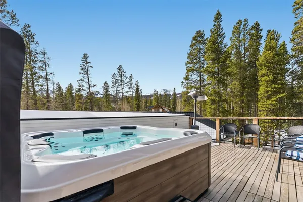 a view of a balcony with wooden floor and outdoor space