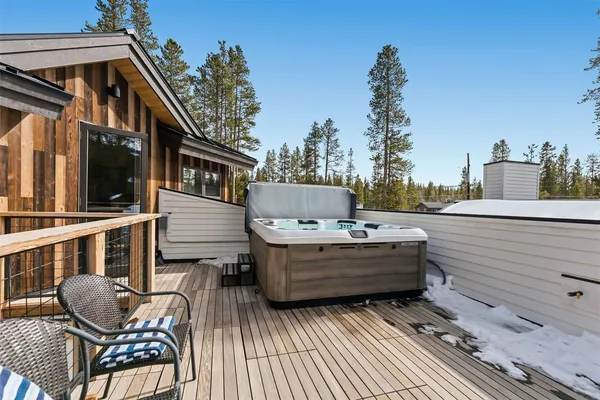 a view of roof deck with patio