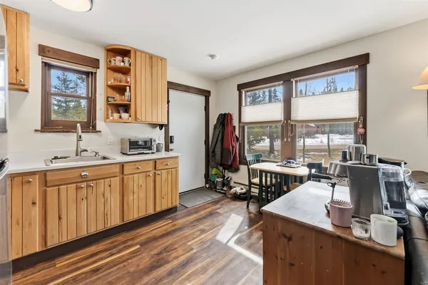 a very nice looking kitchen with a large window