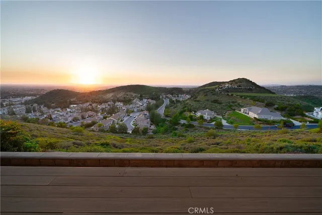 a view of house with garden and tall trees