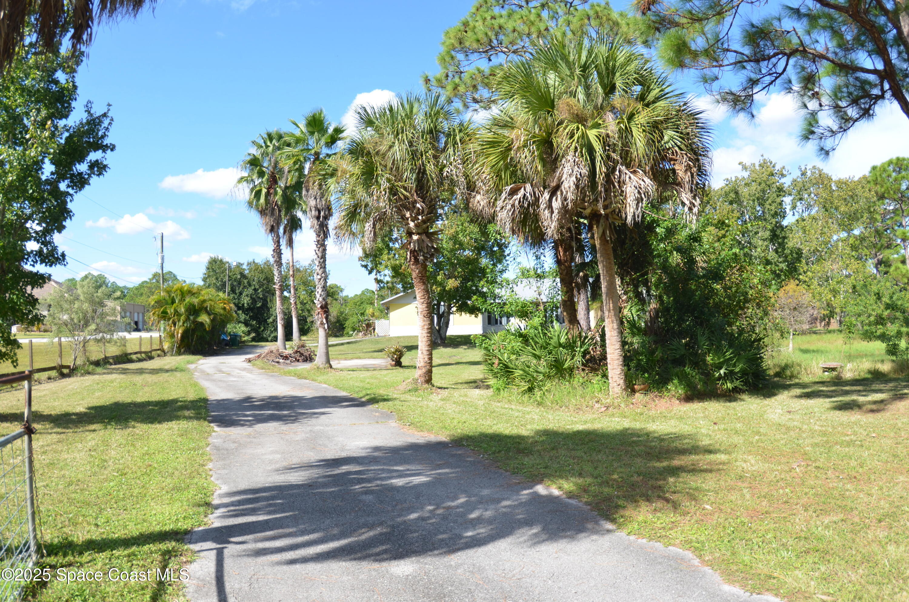 a view of yard with swimming pool