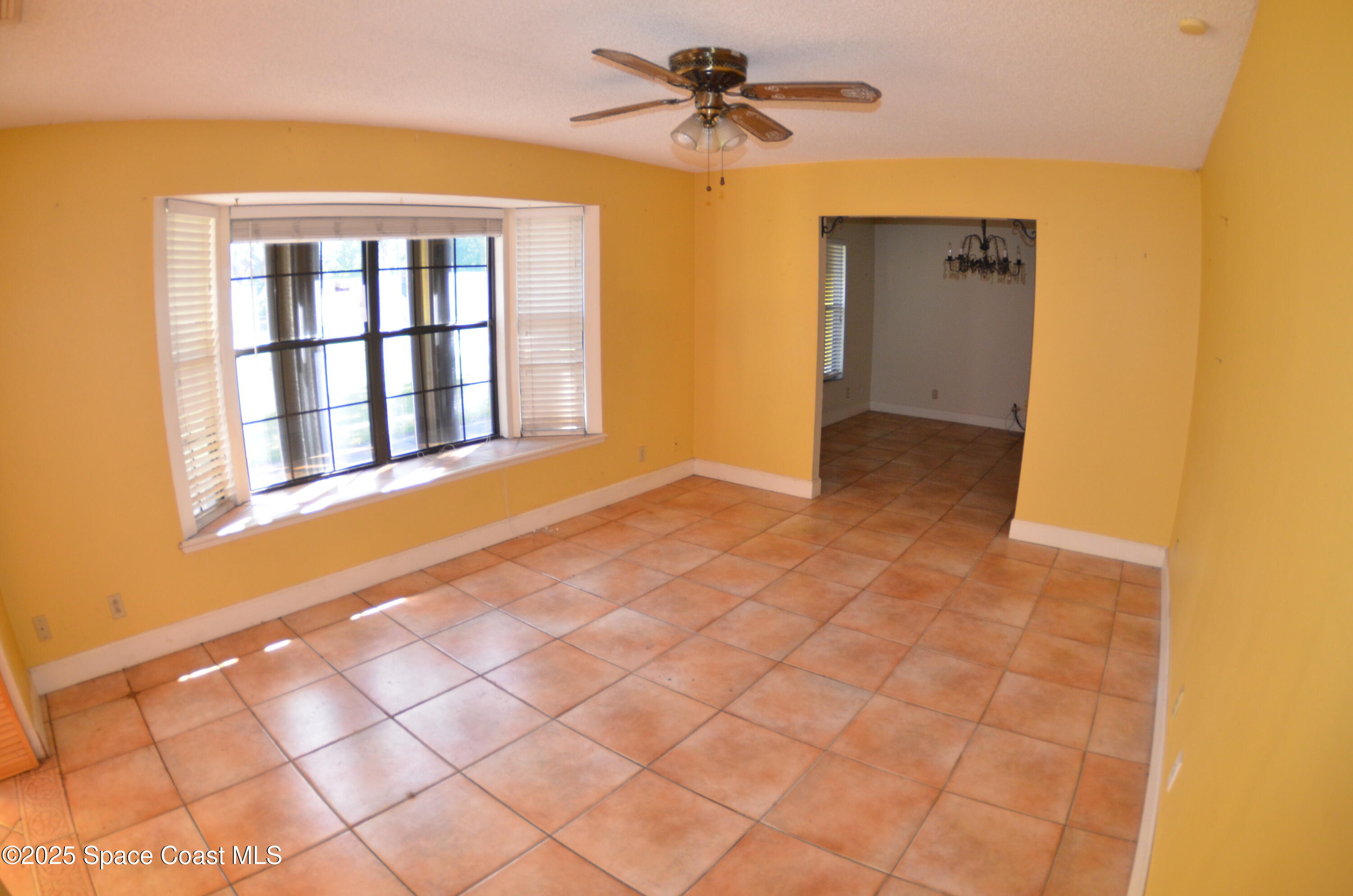 3600 Corey Road Malabar, FL 32950 - Photo 17 of 46 a view of an empty room with a window