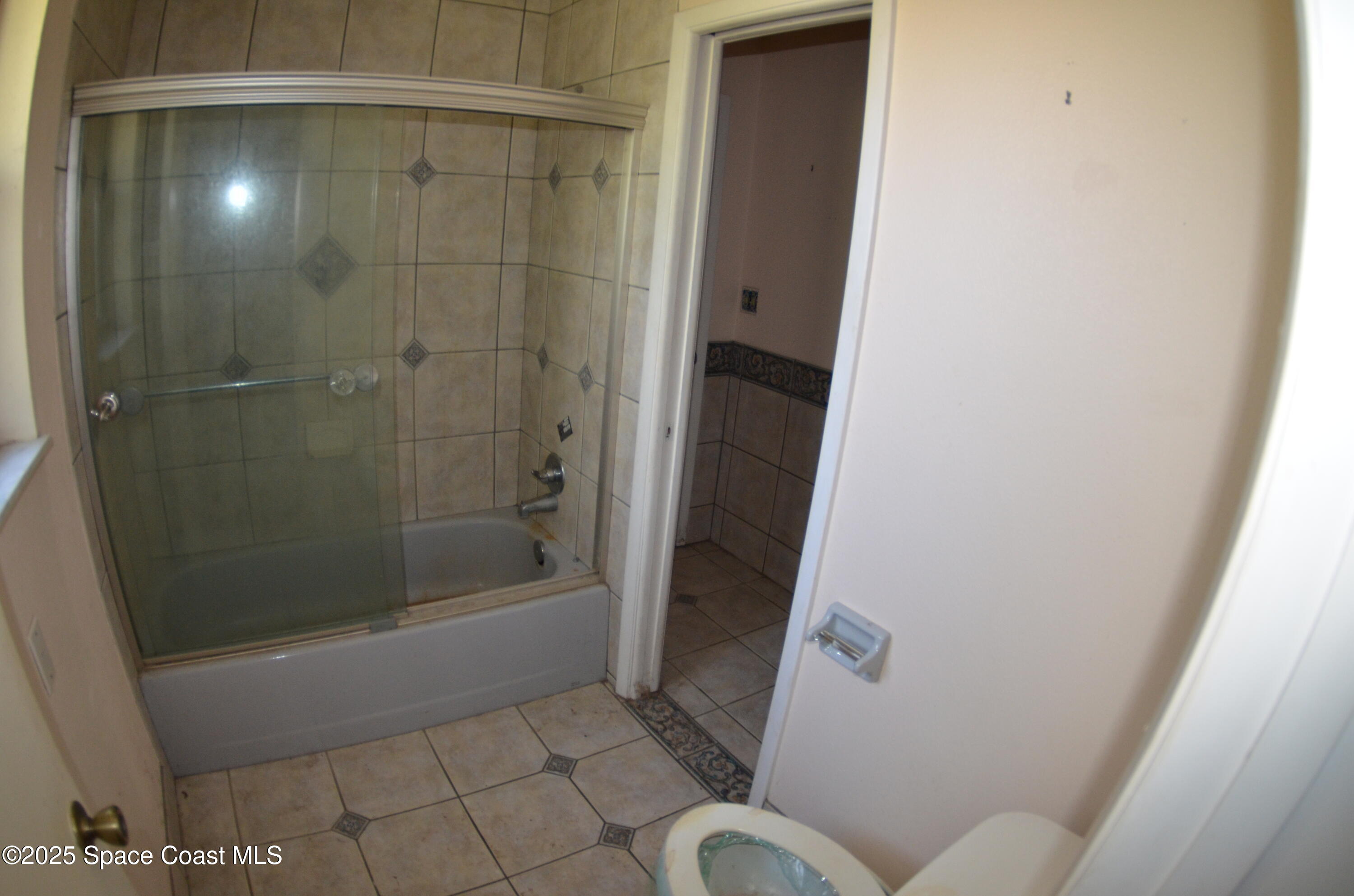 3600 Corey Road Malabar, FL 32950 - Photo 22 of 46 a bathroom with a shower and toilet