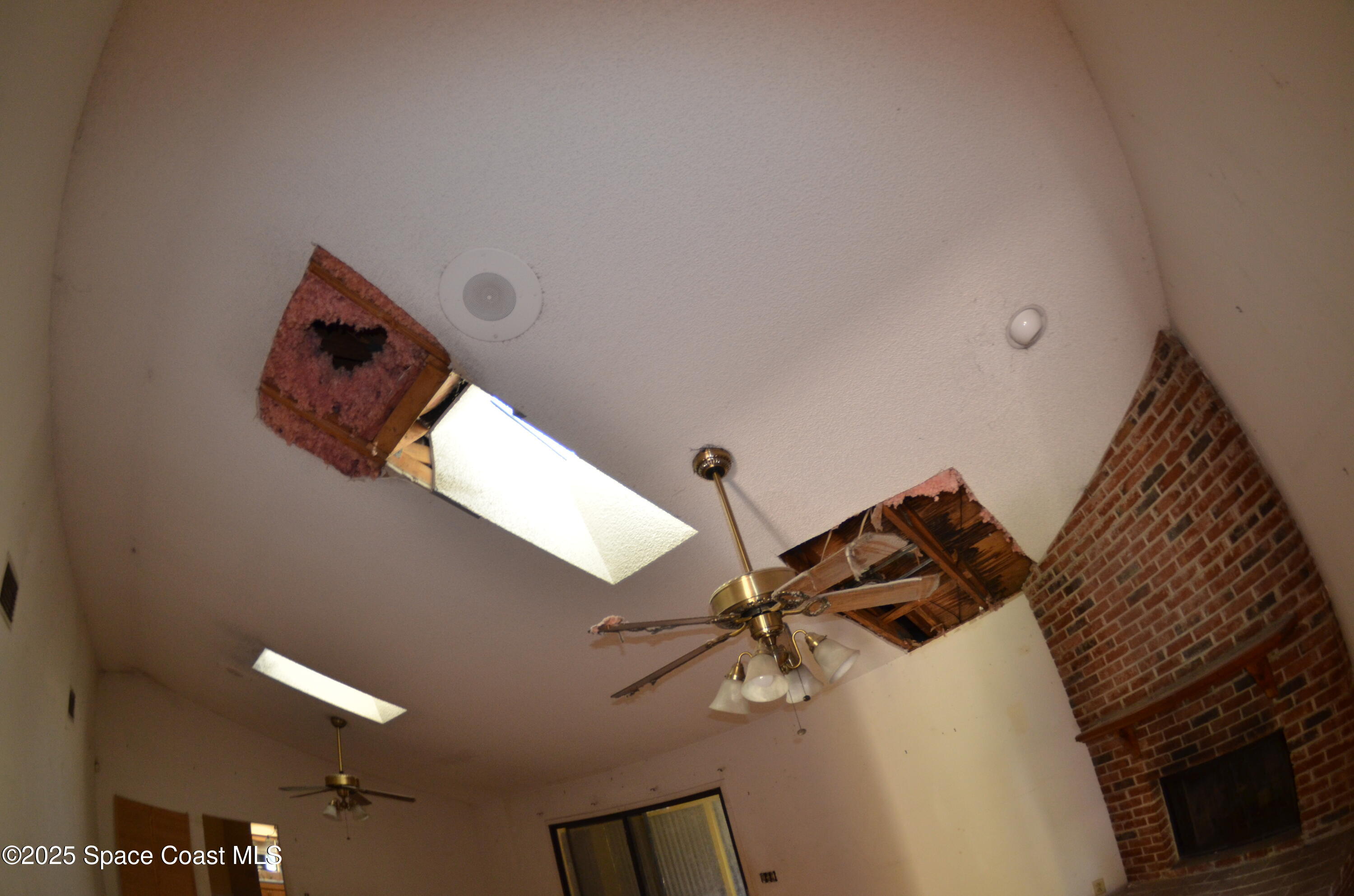 3600 Corey Road Malabar, FL 32950 - Photo 27 of 46 a bedroom with a bed and a ceiling fan