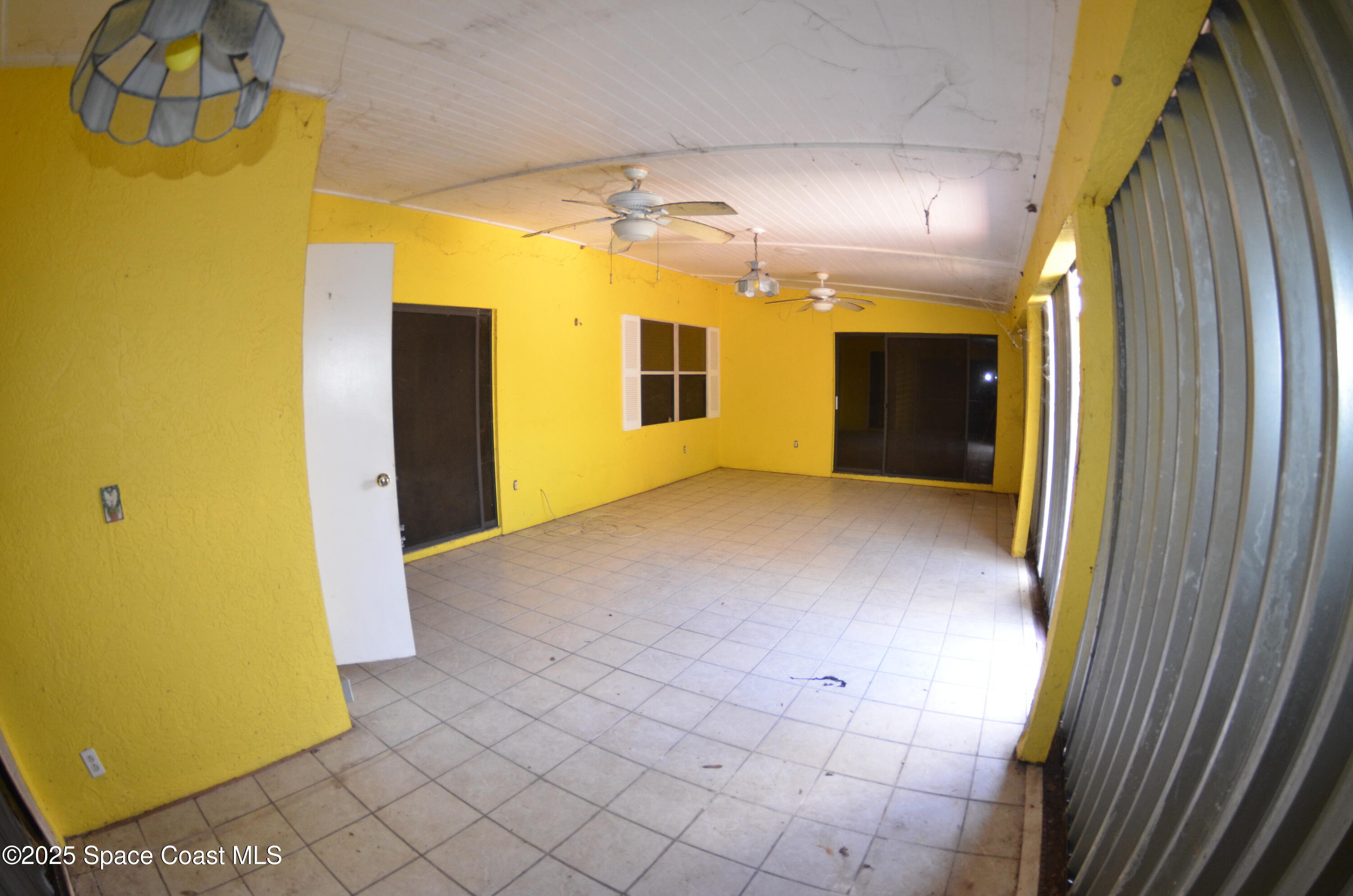 3600 Corey Road Malabar, FL 32950 - Photo 36 of 46 a view of an empty room with glass door