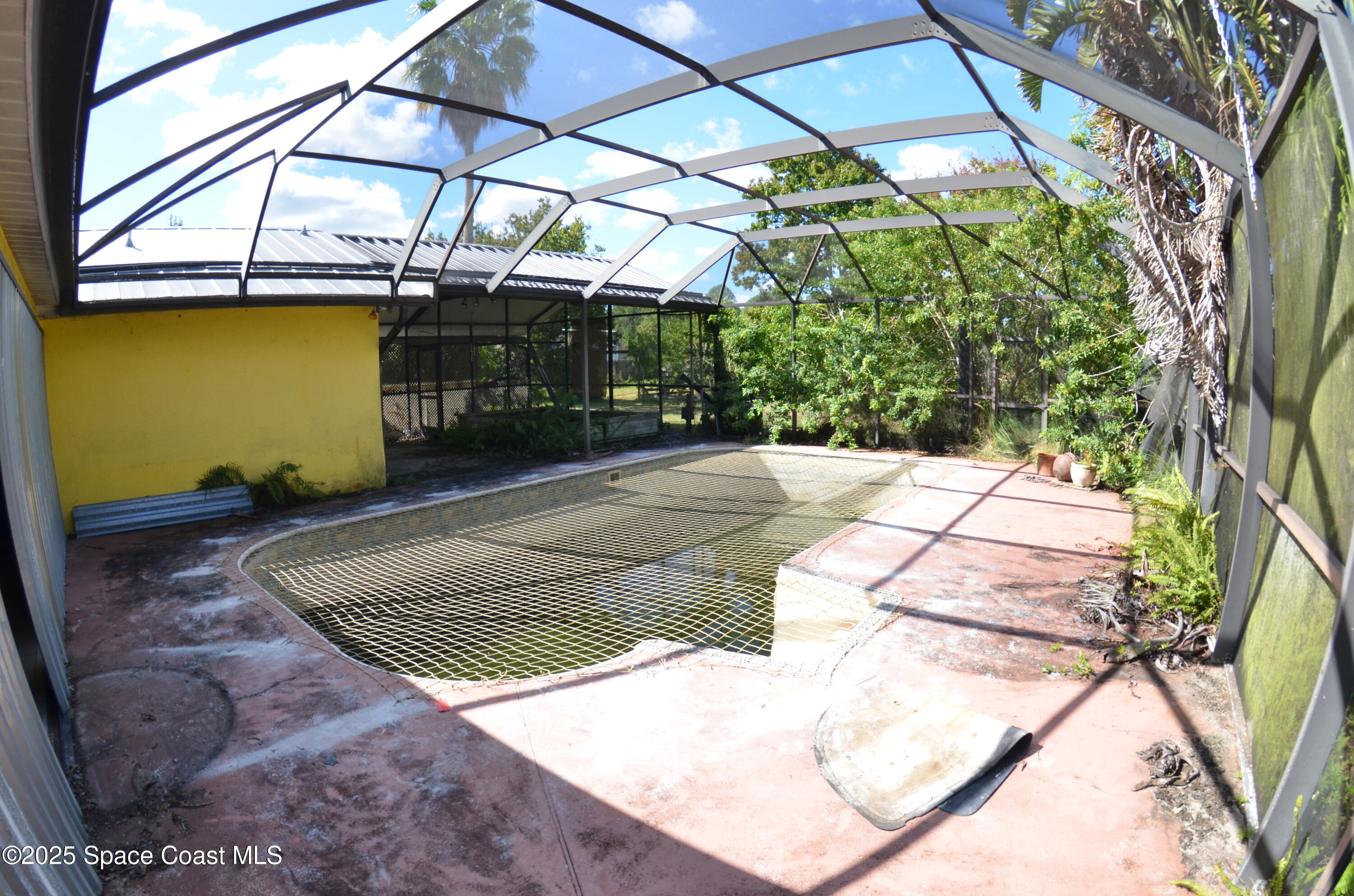 3600 Corey Road Malabar, FL 32950 - Photo 39 of 46 a view of a backyard with a small white house