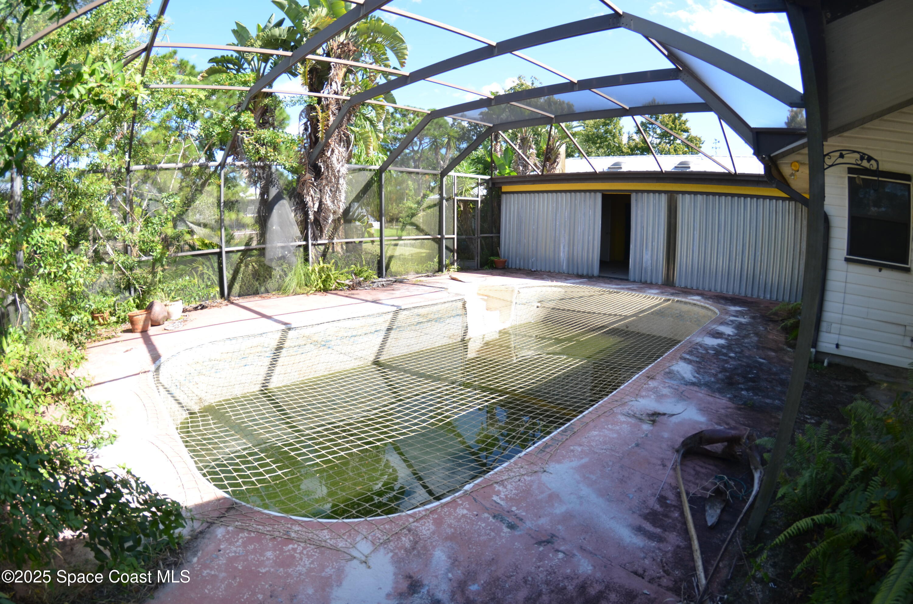 3600 Corey Road Malabar, FL 32950 - Photo 40 of 46 a view of a backyard with a swing