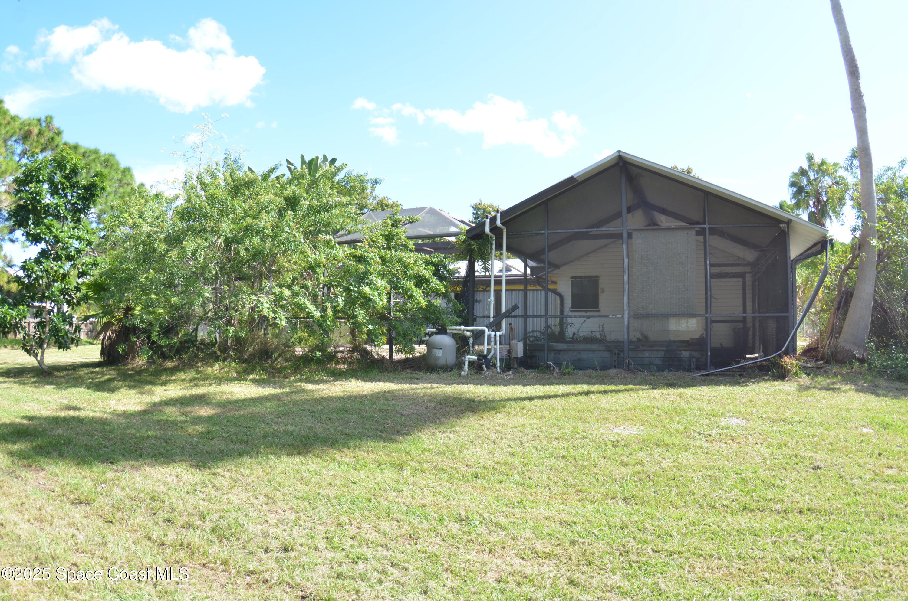 3600 Corey Road Malabar, FL 32950 - Photo 9 of 46 a view of a house with a yard and garage