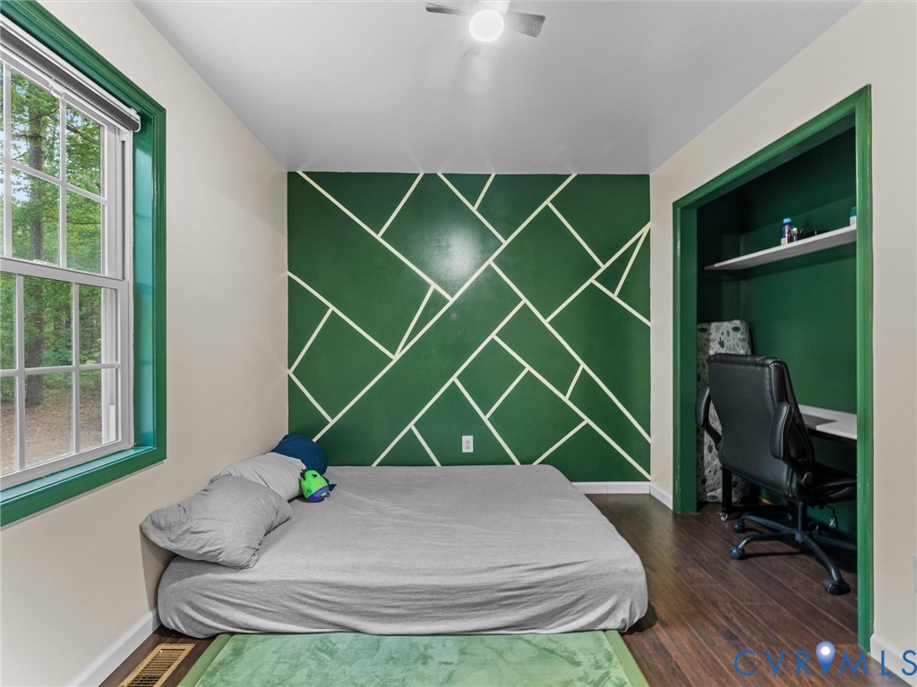 14175 Lebanon Road Disputanta, VA 23842 - Photo 36 of 60 Room featuring a geometric accent wall, wood-finis