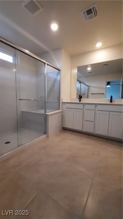 9084 Marigold Crk Street Las Vegas, NV 89113 - Photo 10 of 17 Full bathroom featuring double vanity, a stall shower, light tile patterned floors, and recessed lighting