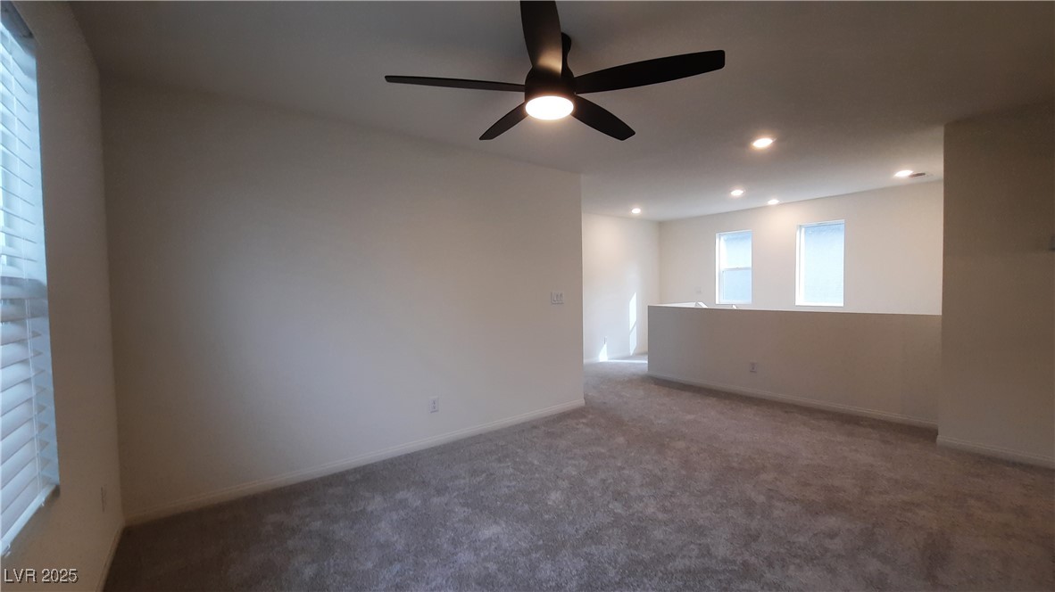 9084 Marigold Crk Street Las Vegas, NV 89113 - Photo 12 of 17 Carpeted empty room featuring ceiling fan and recessed lighting