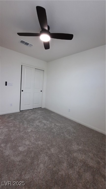 9084 Marigold Crk Street Las Vegas, NV 89113 - Photo 13 of 17 Unfurnished bedroom featuring dark carpet, a closet, and ceiling fan
