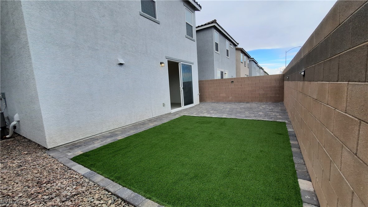 9084 Marigold Crk Street Las Vegas, NV 89113 - Photo 2 of 17 Fenced backyard featuring a patio area