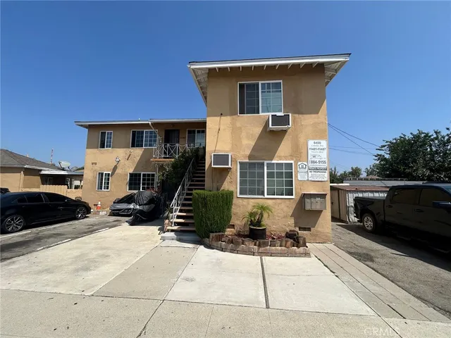 a front view of a house with parking space
