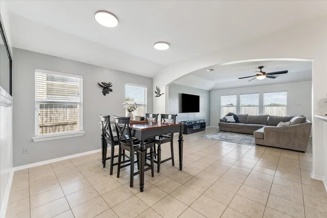 a view of a dining room with furniture and window