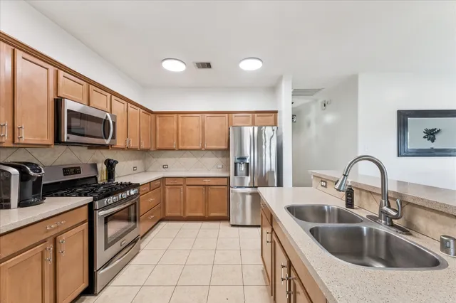 a kitchen with a sink stove and microwave
