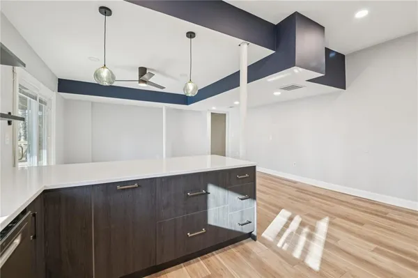 a view of a kitchen with cabinets