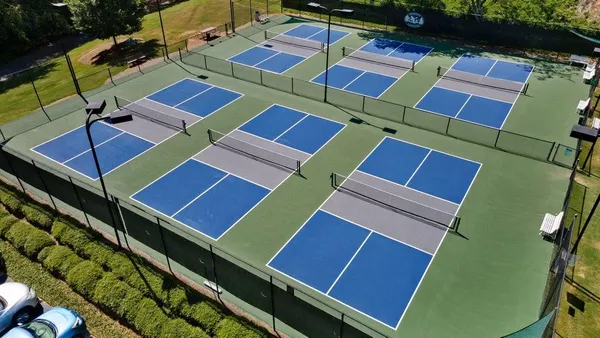 a view of a tennis ground with windows