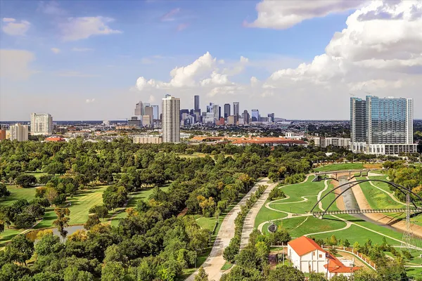 a spacious bathroom with a granite countertop sink and a large mirror