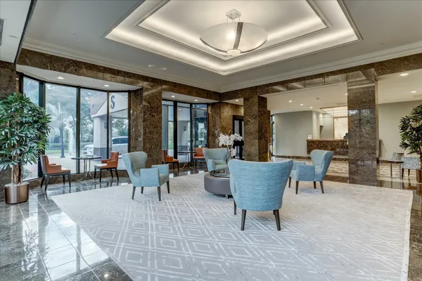 a view of a livingroom with furniture window and wooden floor