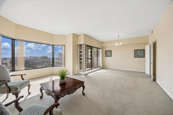 a view of livingroom with furniture and dining table