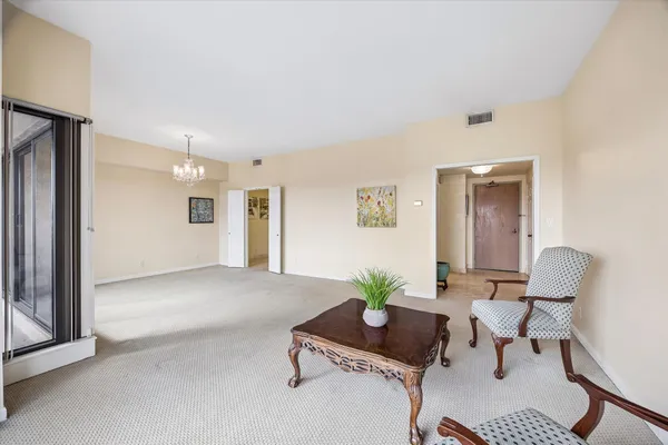 a view of an empty room with a window