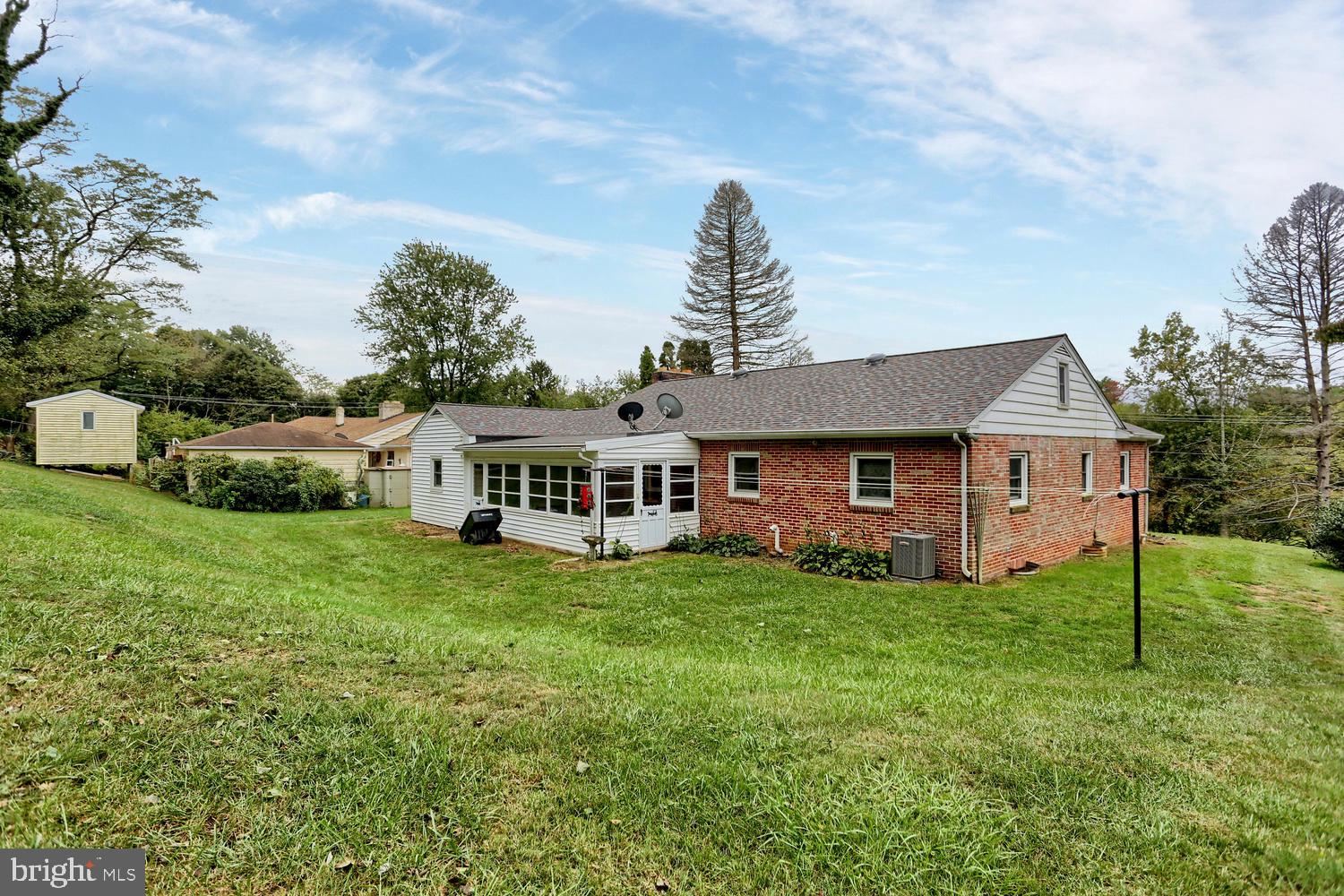 113 Country Club Road Red Lion, PA 17356 - Photo 23 of 31 a house that is sitting in the grass with large trees and plants