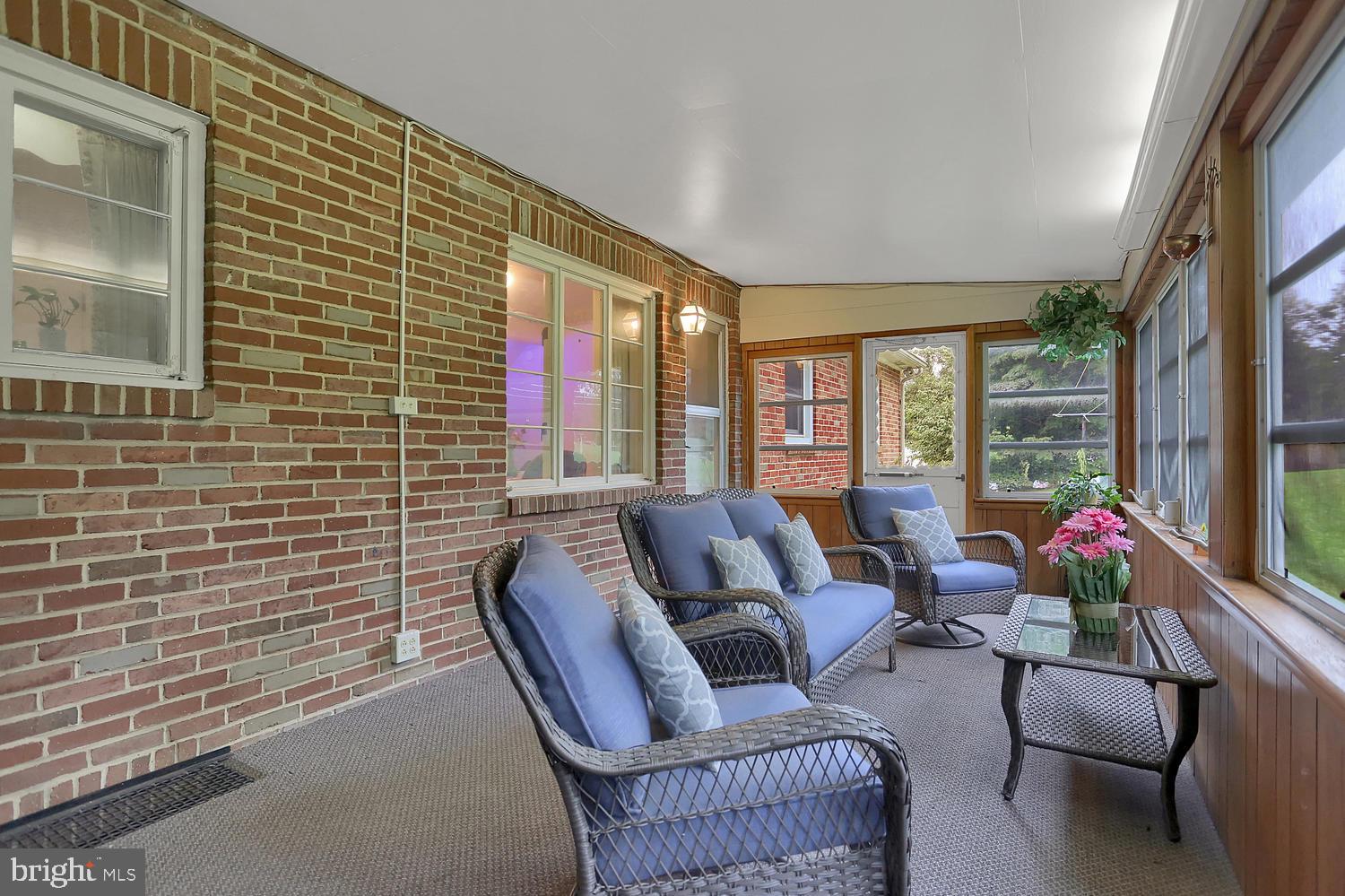 113 Country Club Road Red Lion, PA 17356 - Photo 31 of 31 a living room with furniture and a floor to ceiling window